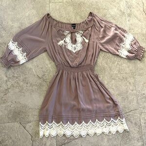 Gently used BEBE silk dress with crochet trim and cold shoulder sleeve